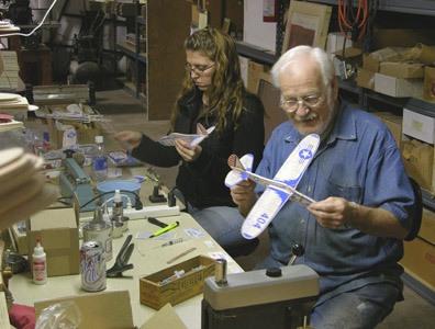 Sarah Lander helping Frank Macy build 404 Interceptor II's