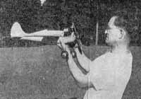 Jim Walker examining his American Junior Fireball U-Control model airplane