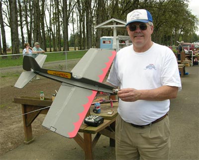 Merle Hoem holds his Foamy Firecat, a radio controlled plane of his own design